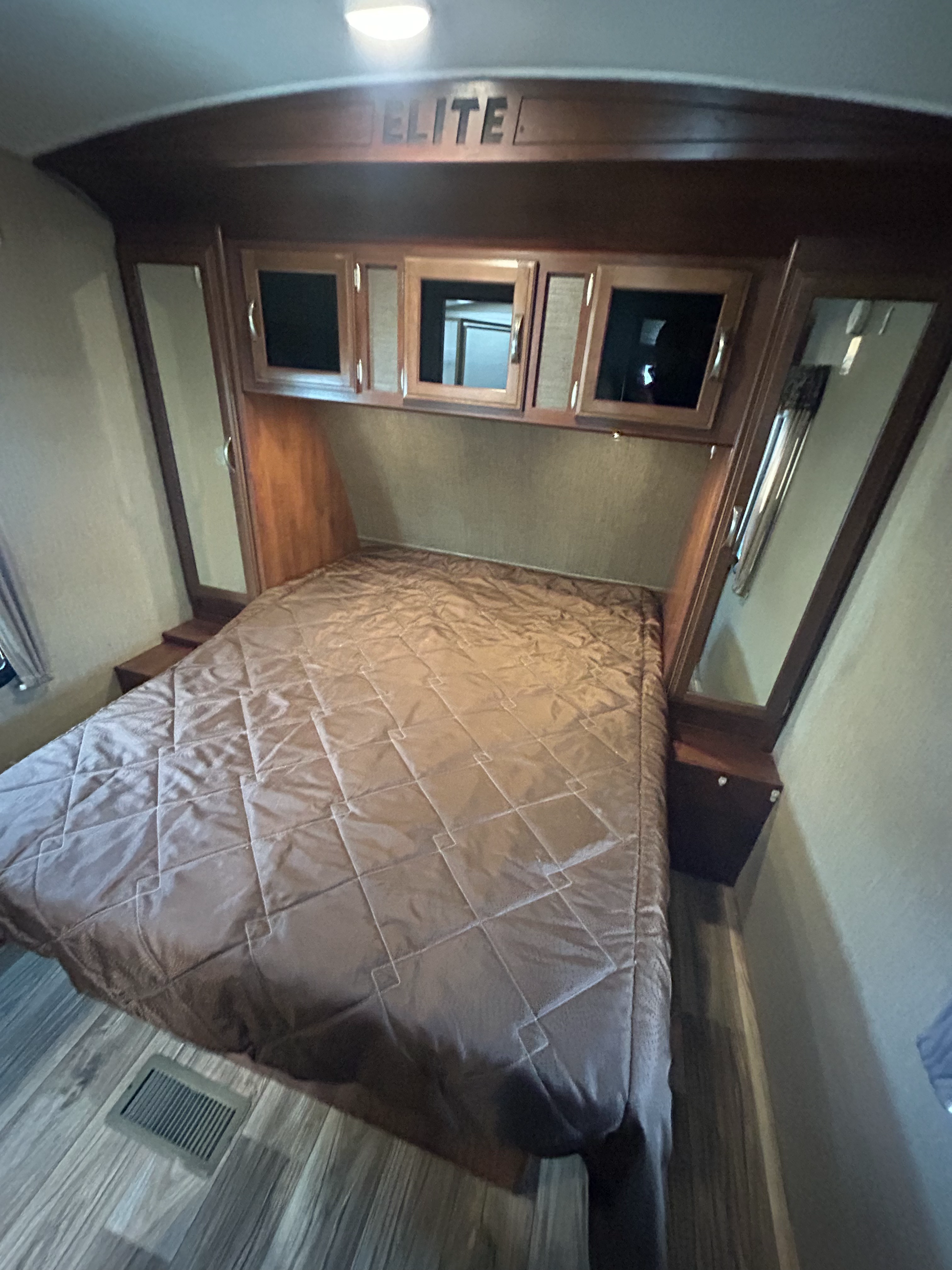 2015_Keystone_Passport_Elite_31RE_travel_trailer showing master bedroom