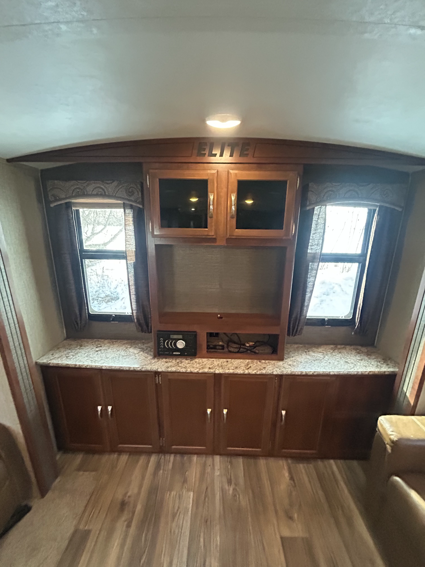 2015_Keystone_Passport_Elite_31RE_travel_trailer showing entertainment wall centre
