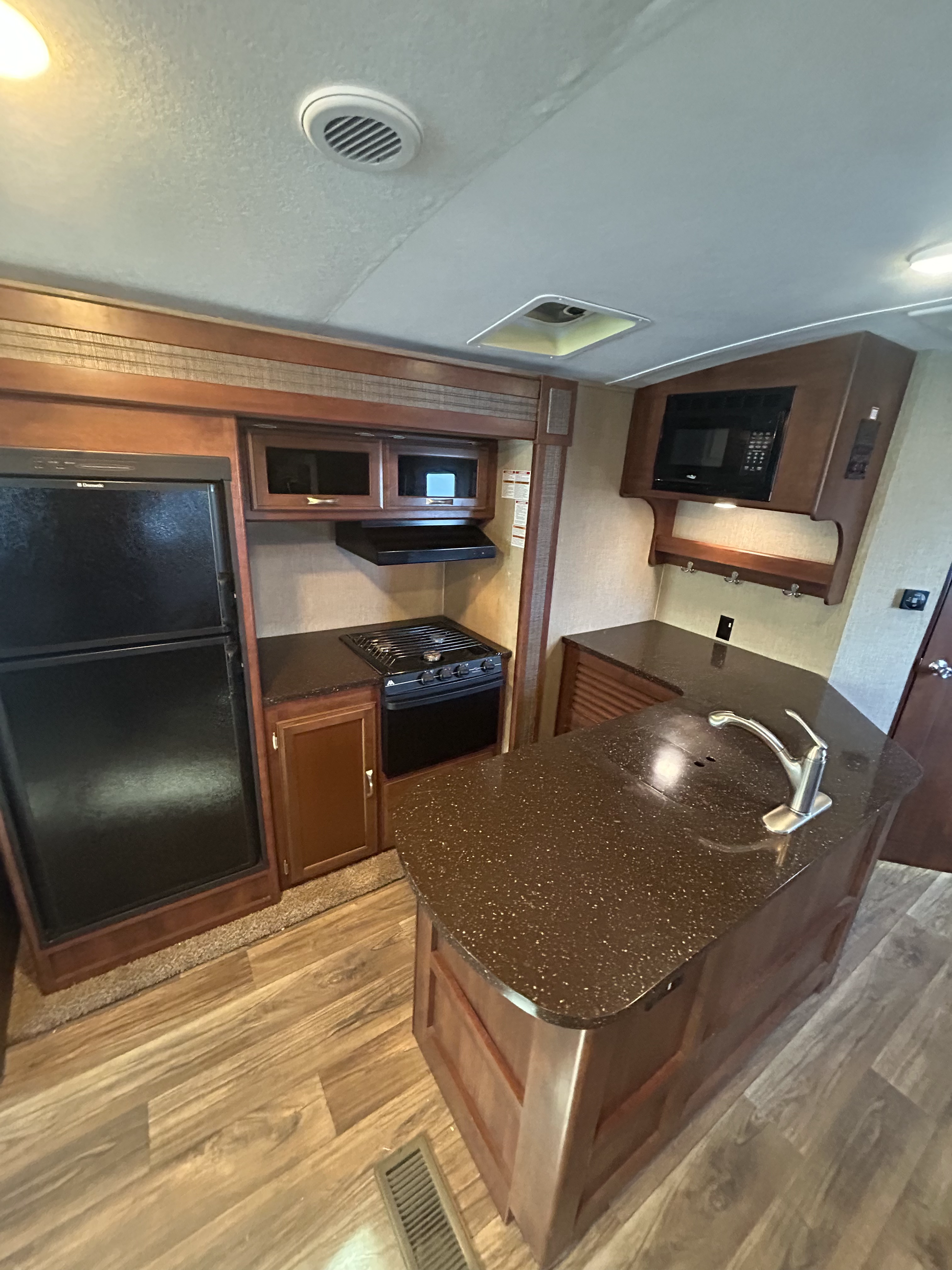 2015_Keystone_Passport_Elite_31RE_travel_trailer showing beautiful luxury kitchen