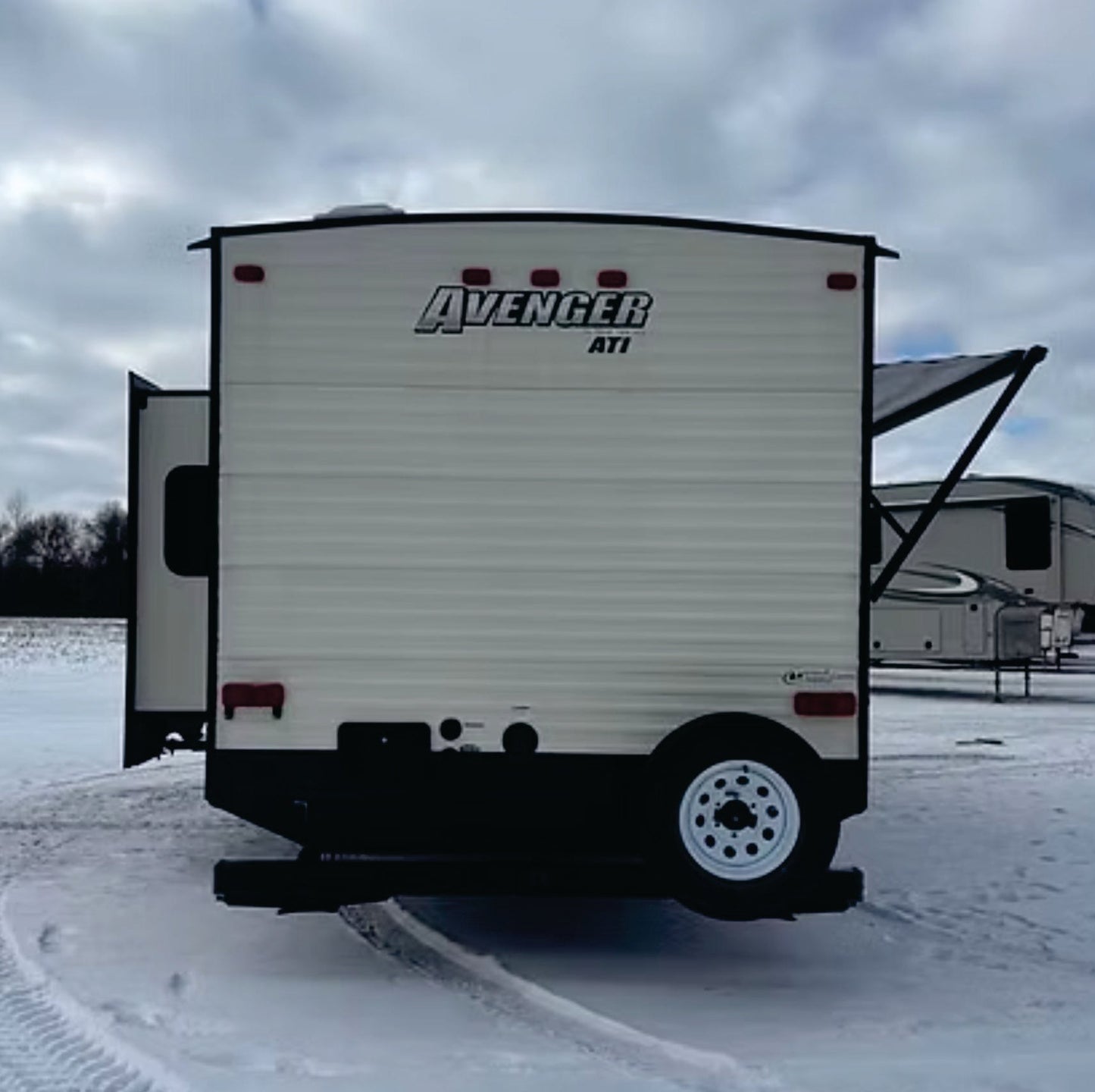 2018 Forest River Avenger 7DBS Travel Trailer back with slide and awning
