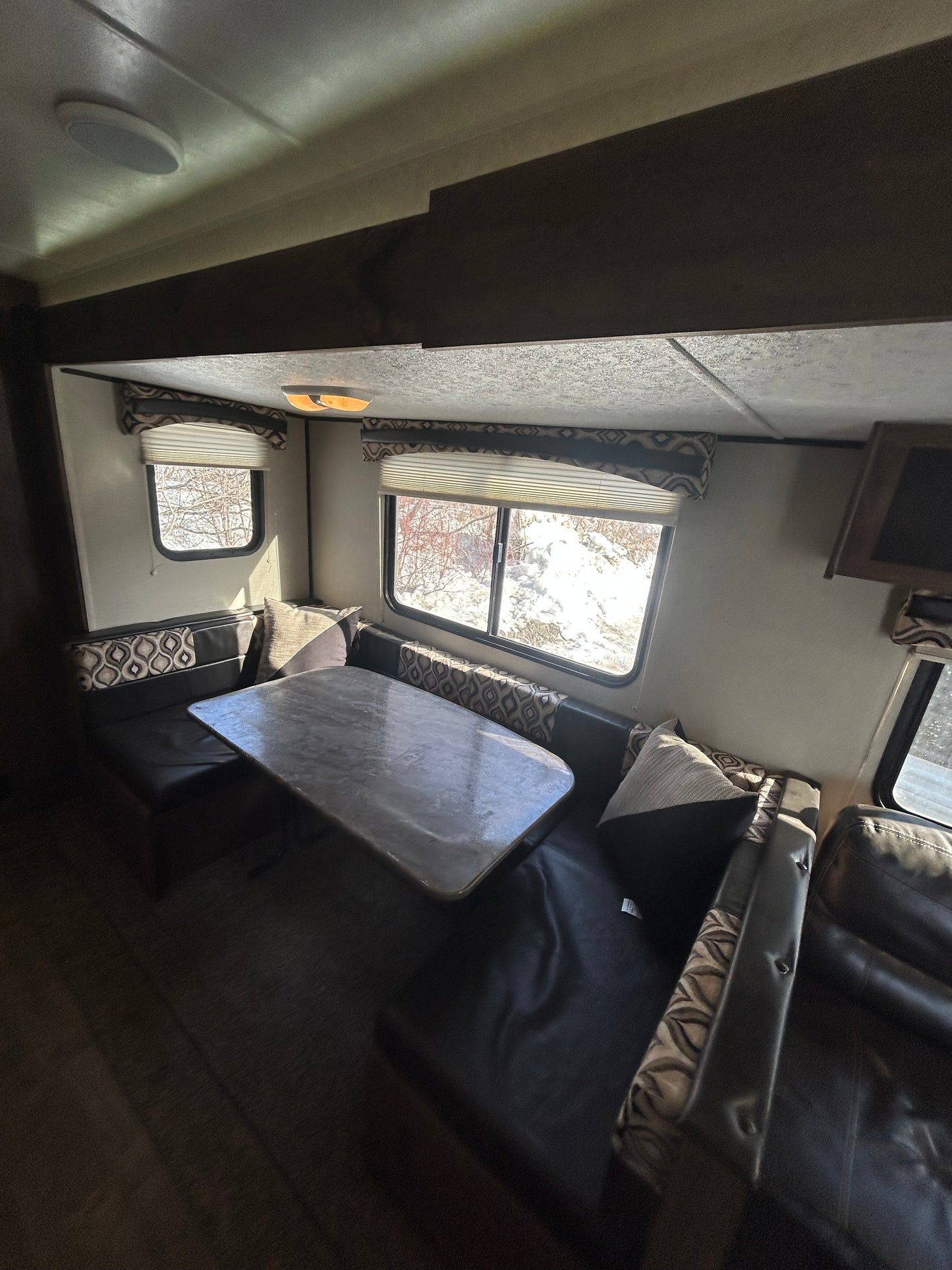2018 Prowler Lynx 30LX travel trailer showing living space and U-shape dinette