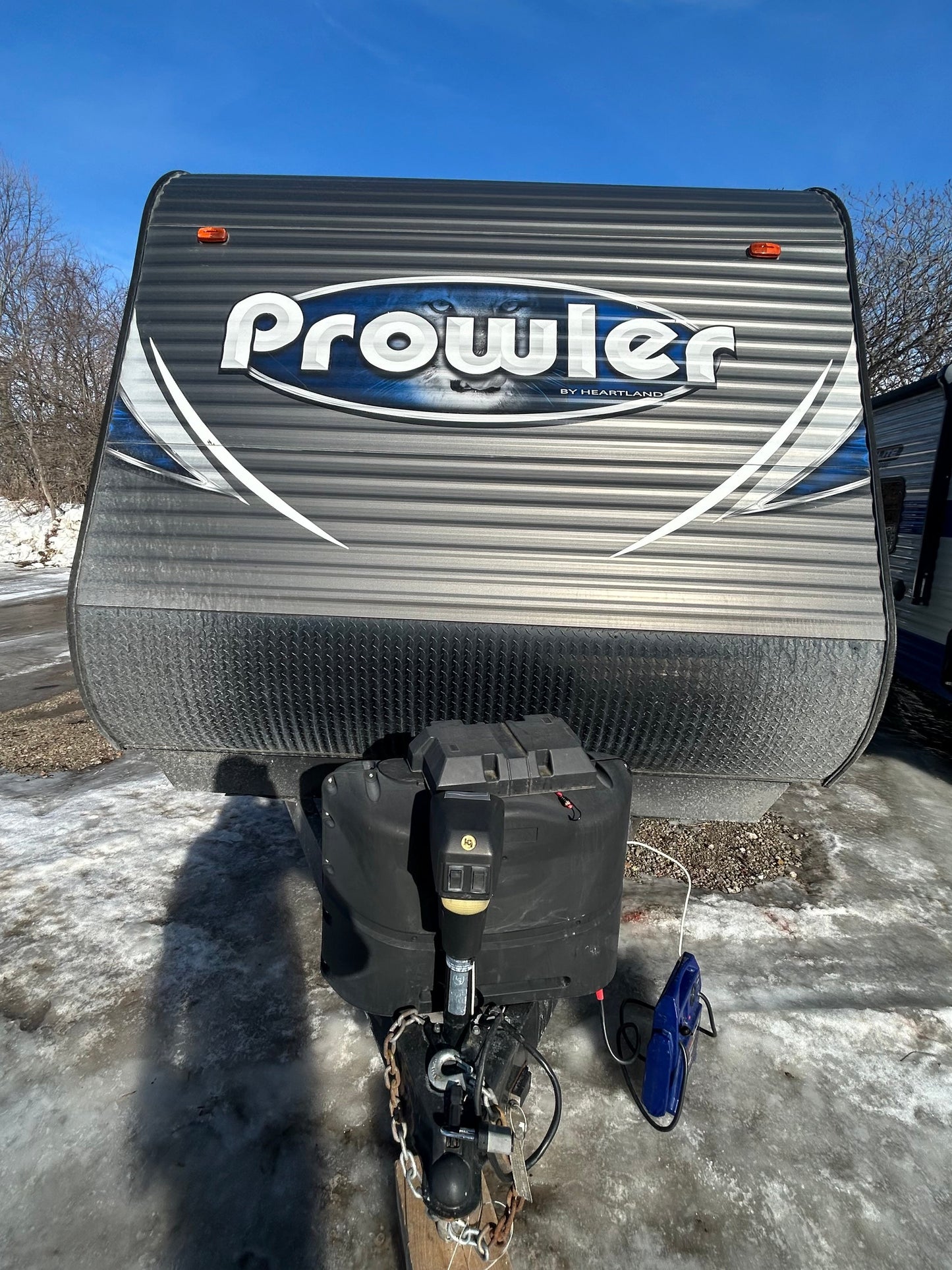2018 Prowler Lynx 30LX Travel Trailer showing front of trailer with propane tanks
